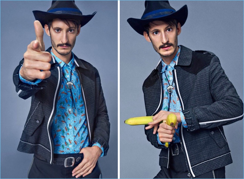 Making a western statement, Pierre Niney wears a jacket and pants by Lanvin. Niney also sports a Prada shirt, Dsquared2 belt, and Maison Michel hat.