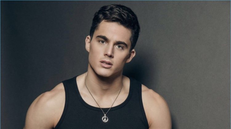 Italian model Pietro Boselli sports a black BENCH tank with trousers and a necklace by Paul Smith.