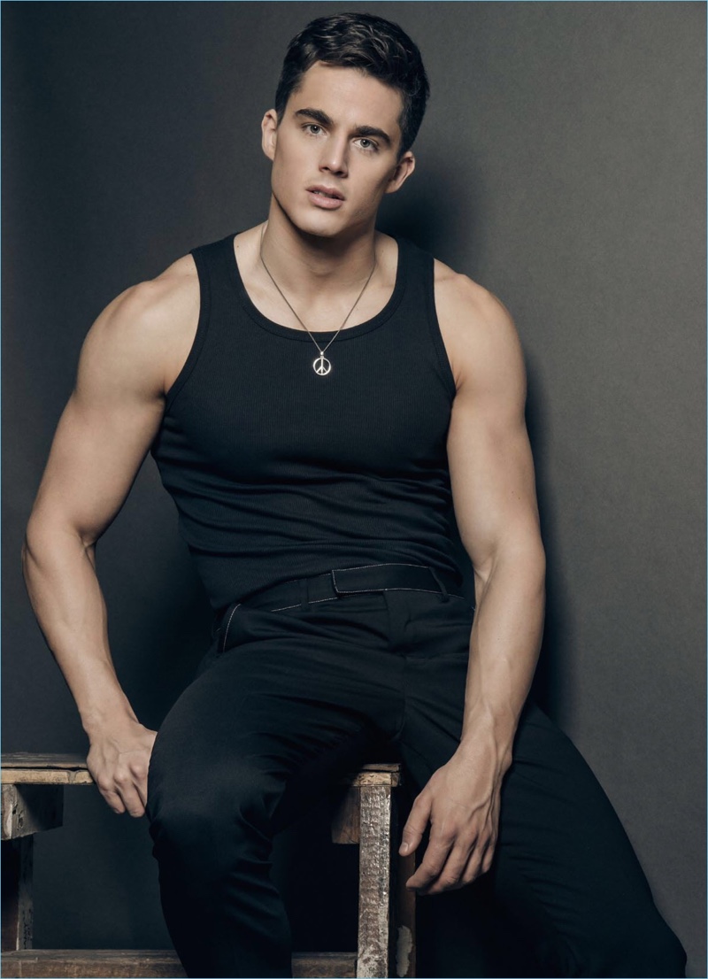 Italian model Pietro Boselli sports a black BENCH tank with trousers and a necklace by Paul Smith.