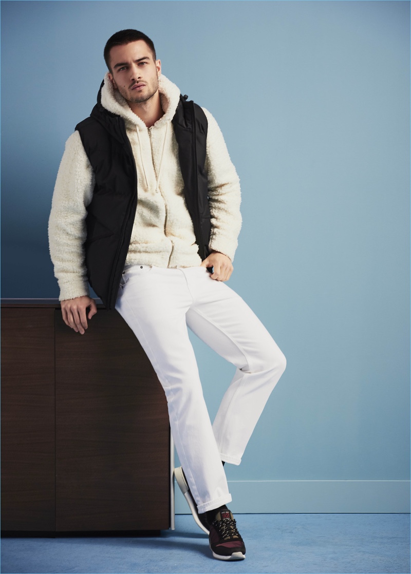 Aleksander Rusic sports a fleece full-zip hoodie with a vest and white jeans from River Island's fall-winter 2017 collection.