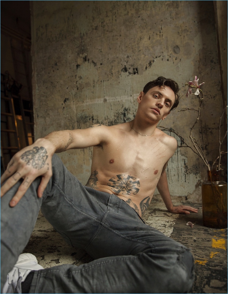 Going shirtless, Sergei Polunin wears Diesel jeans with Y-3 sneakers.