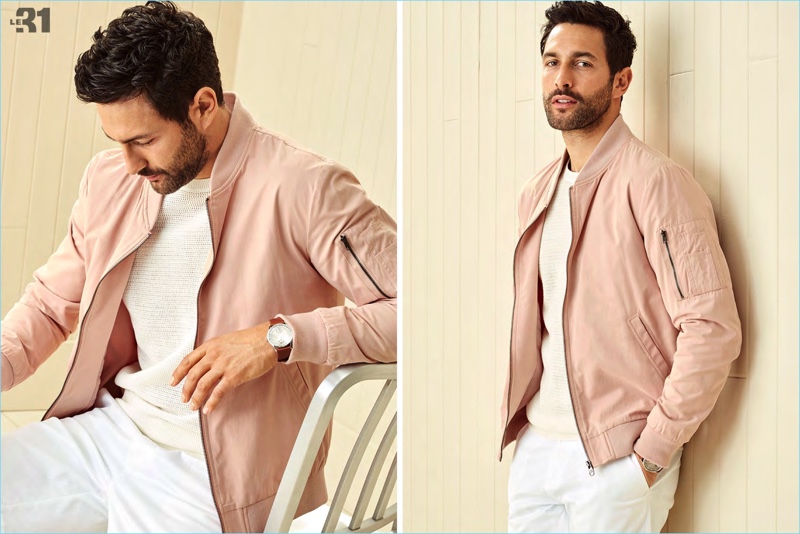 Connecting with Simons, Noah Mills sports a pink bomber jacket and white summer fashions.