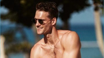 Tomas Skoloudik Takes to the Beach with Solid & Striped Tomas Skoloudik wears striped swim shorts from Solid & Striped.