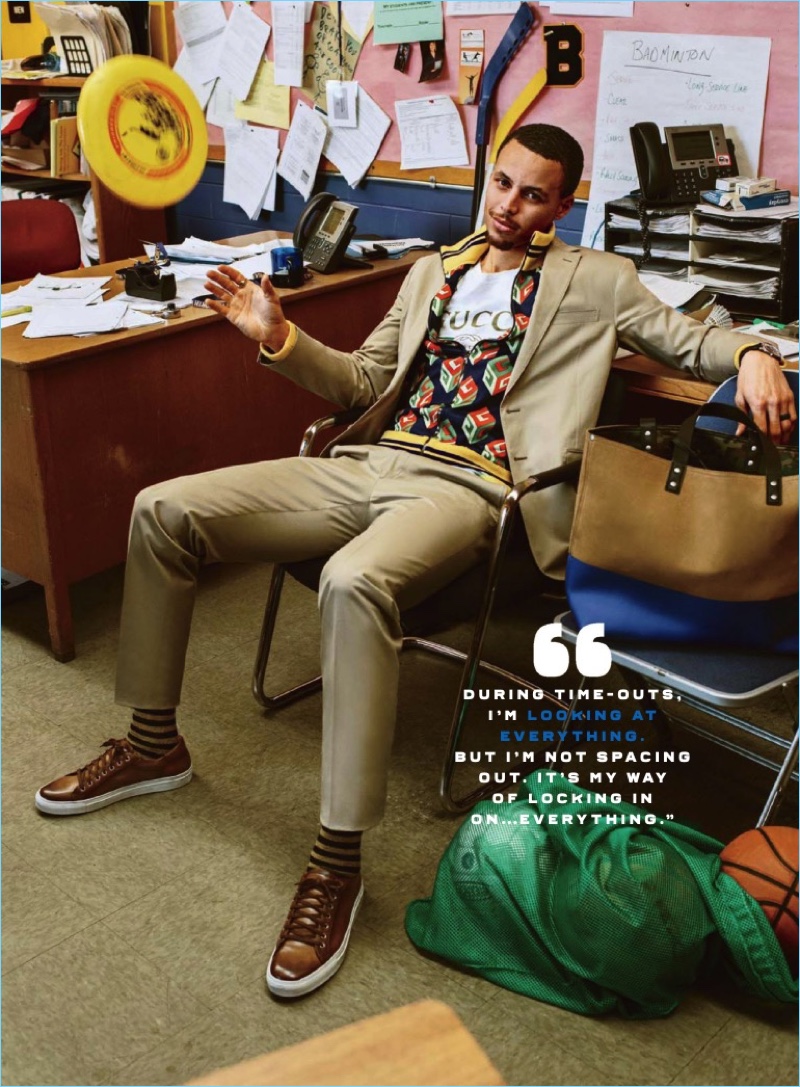 Relaxing, Steph Curry wears a Ralph Lauren suit and sneakers. Curry also rocks a t-shirt and track jacket by Gucci.