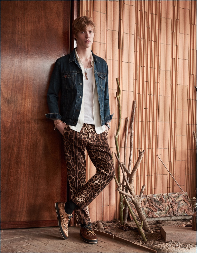 Making a wild statement, Sven de Vries wears leopard print Dolce & Gabbana pants with a Levi's denim jacket. Sven also sports a Sandro shirt and Dolce & Gabbana shoes.