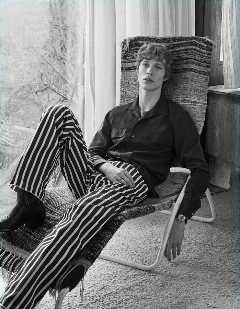 Lounging, Sven de Vries wears a Ralph Lauren Purple shirt with Hilfiger Edition striped pants.