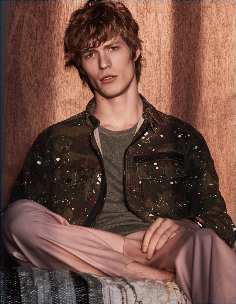 Sven de Vries wears a denim jacket by G-Star Raw with an Eric Bompard sweater and Paul & Joe pants.