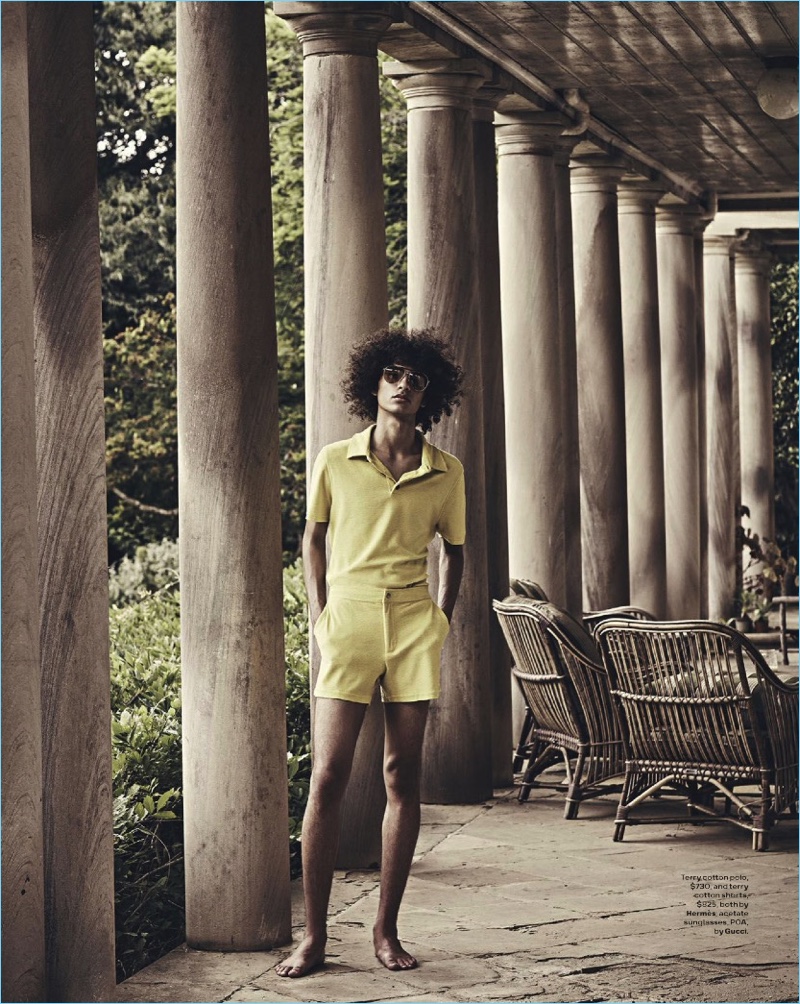 Standing out in yellow, Trè Samuels wears a terry polo and shorts by Hermes with Gucci sunglasses.