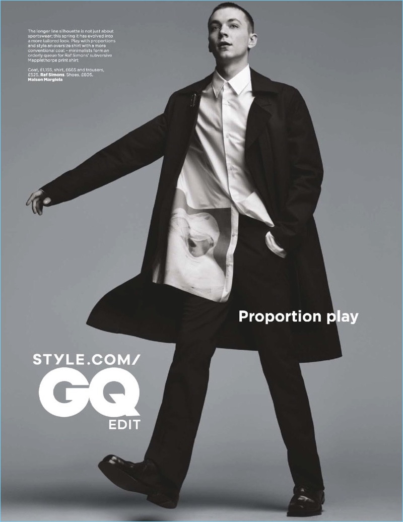 Yuri Pleskun sports a shirt, coat, and trousers by Raf Simons with Maison Margiela shoes.