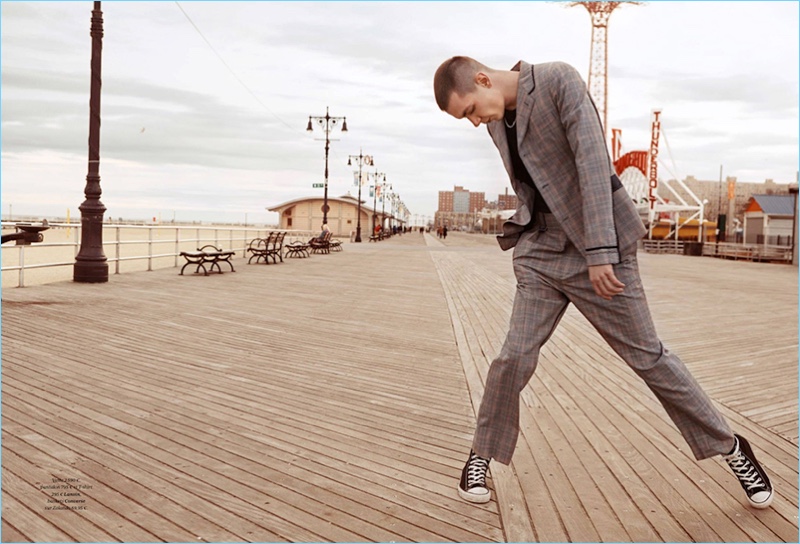 Appearing in an editorial for GQ France, Yuri Pleskun wears an Ermenegildo Zegna suit with a vintage t-shirt and Converse sneakers.