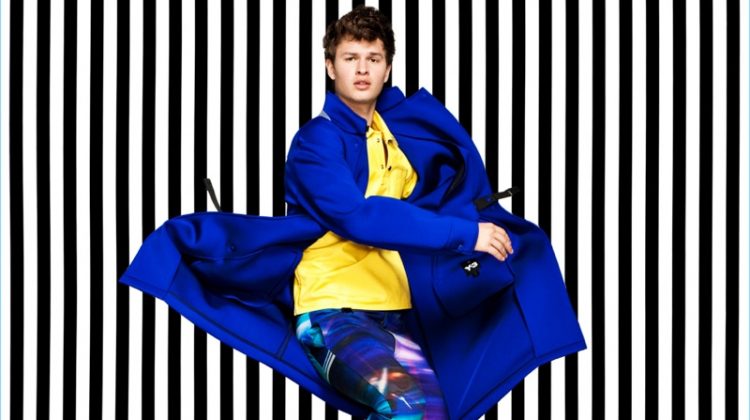 Making a colorful statement, Ansel Elgort rocks a blue Y-3 coat.