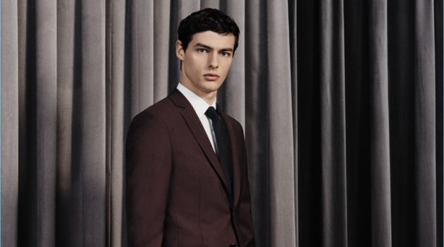 Hannes Gobeyn dons a sharp suit from BOSS' fall-winter 2017 travel collection.