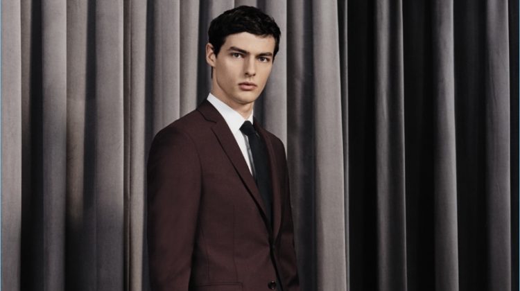 Hannes Gobeyn dons a sharp suit from BOSS' fall-winter 2017 travel collection.