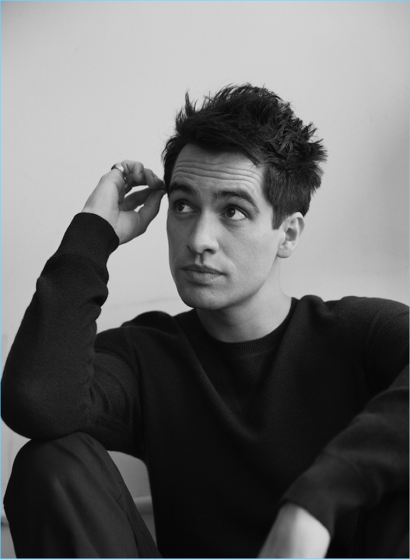 Singer Brendon Urie wears an Acne Studios sweater with Frame jeans.