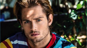 Chad James Buchanan wears a colorful Tommy Hilfiger sweater for Da Man.