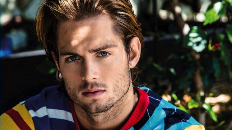 Chad James Buchanan wears a colorful Tommy Hilfiger sweater for Da Man.