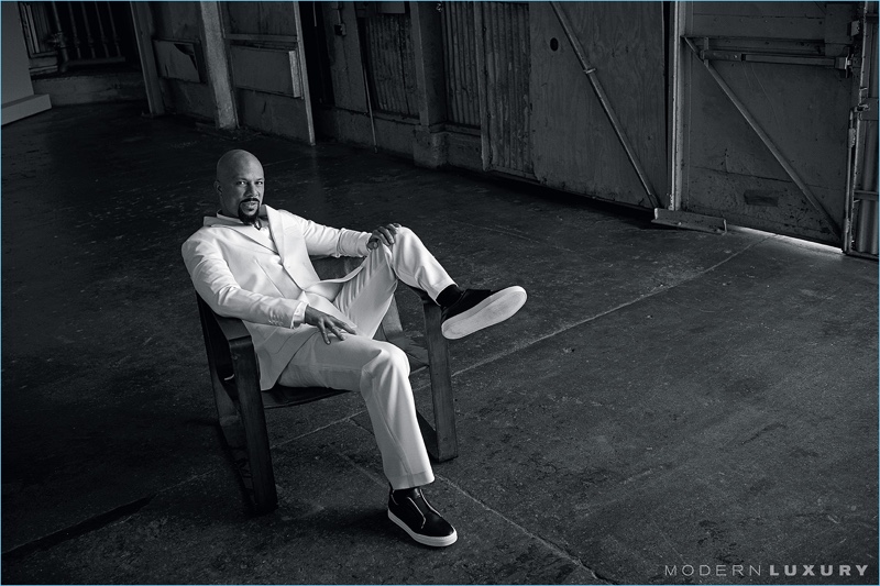 A vision in white, Common wears a Carlos Campos suit with a Dior Homme shirt and Pierre Hardy sneakers.