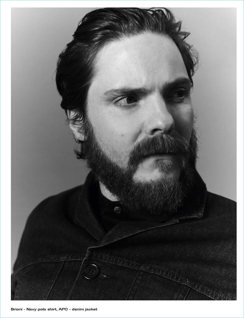 Daniel Brühl wears a Brioni polo with an A.P.C. denim jacket.