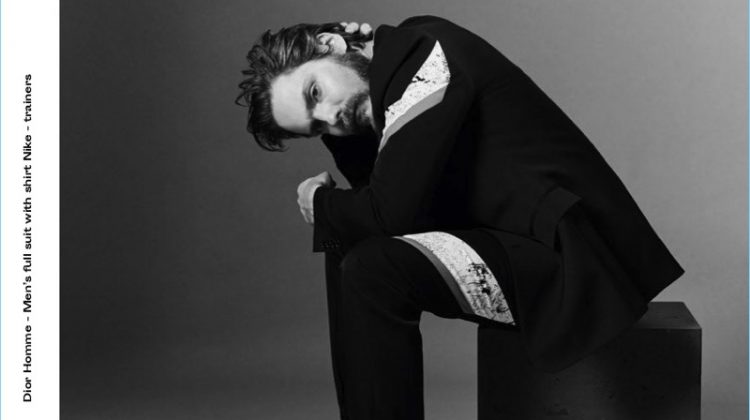 Appearing in a photo shoot for Crash magazine, Daniel Brühl sports a Dior Homme shirt and suit with Nike sneakers.