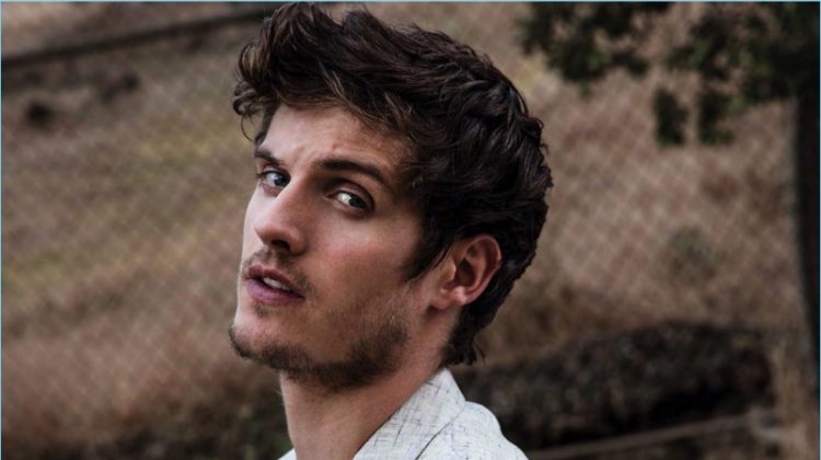 Venturing outdoors, Daniel Sharman sports a Calvin Klein t-shirt with a John Varvatos blazer.