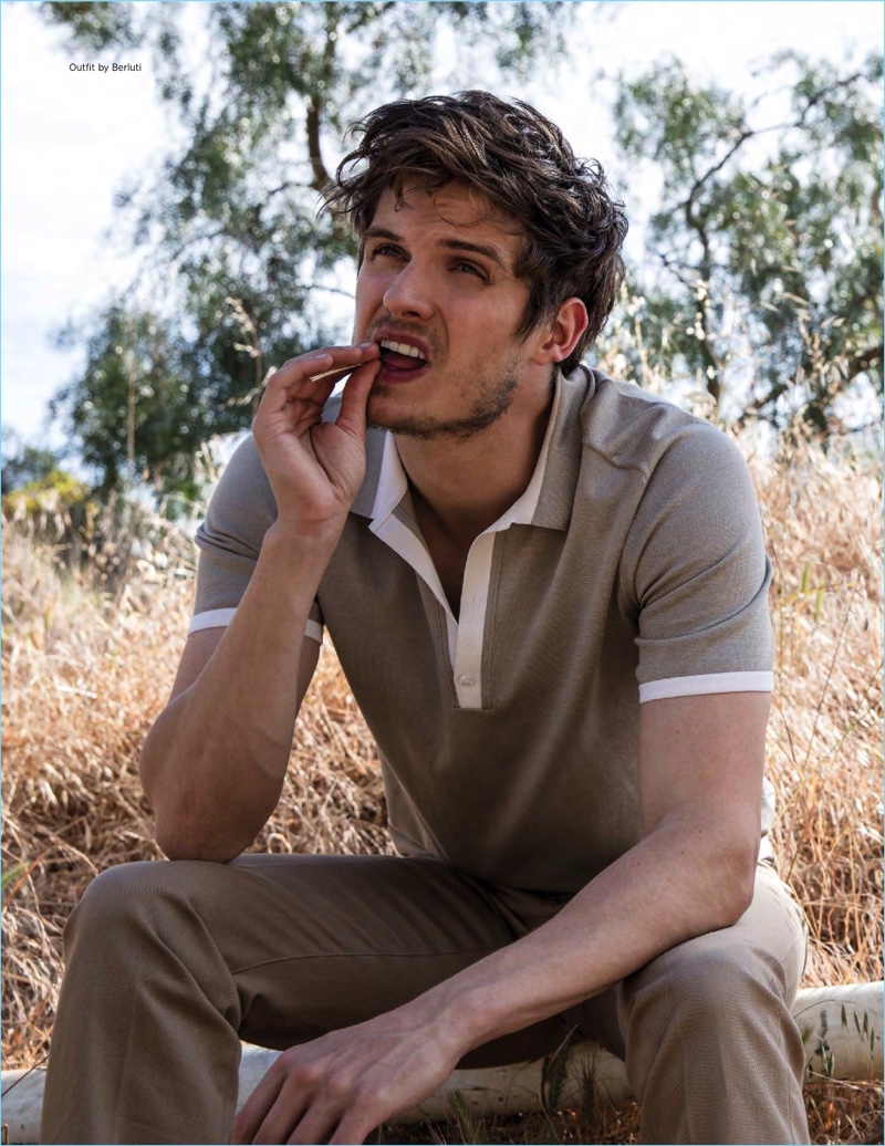 Embracing neutrals, Daniel Sharman wears a polo and pants by Berluti.