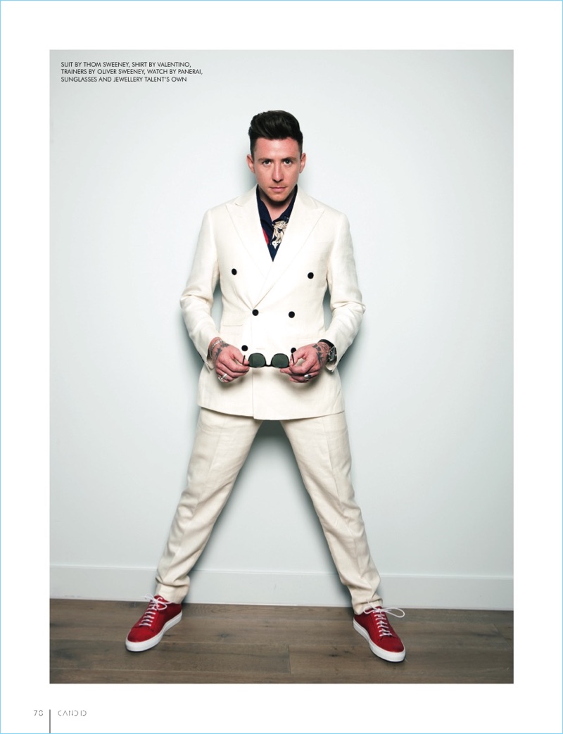 Music artist Danny Jones wears a double-breasted Thom Sweeney suit with a Valentino shirt. He also sports Oliver Sweeney sneakers.
