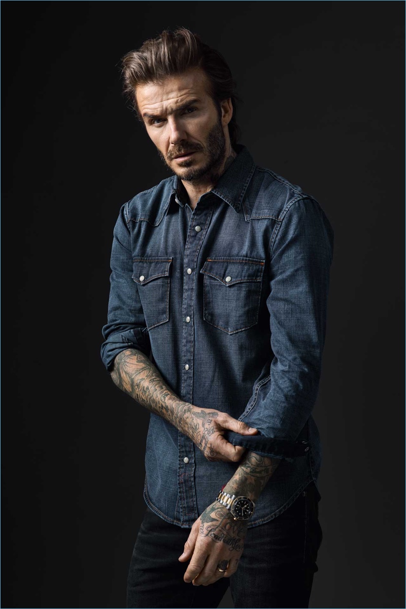 David Beckham dons an AMI denim shirt $192 and Tudor watch for the brand's new campaign.