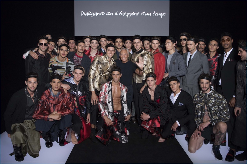 Giorgio Armani poses with the models who participated in his spring-summer 2018 show for Emporio Armani.