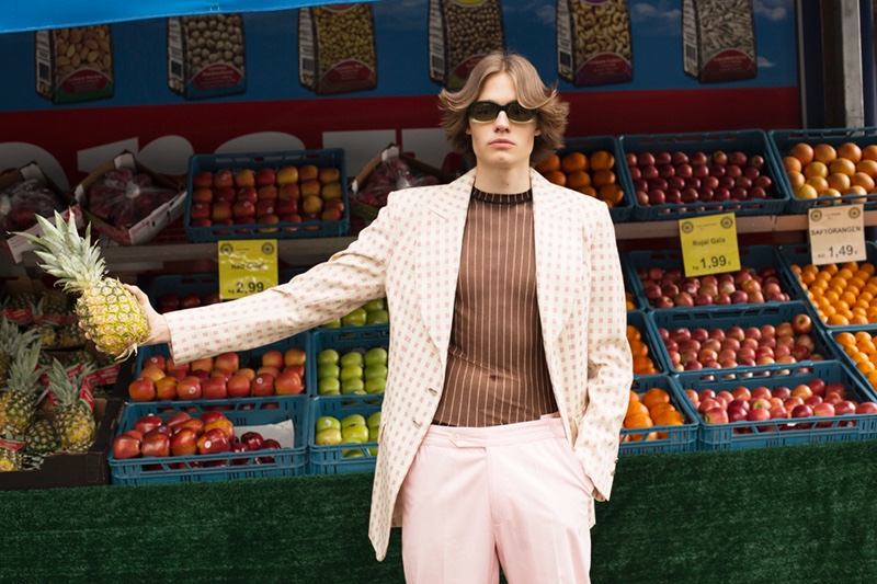 Carl wears jacket Vivienne Westwood, top Jean Paul Gaultier, vintage trousers, and sunglasses Gucci.