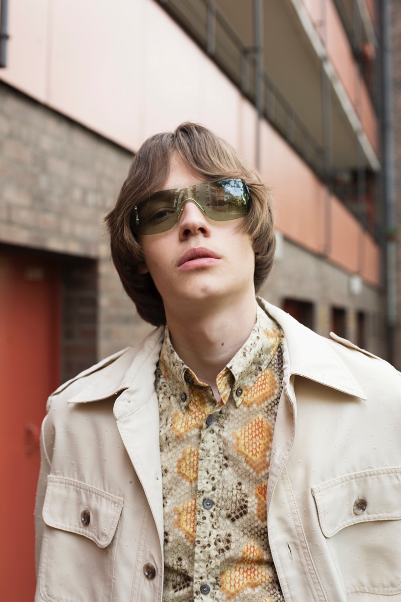 Carl wears shirt John Galliano, jacket Christian Dior, and sunglasses Gucci.