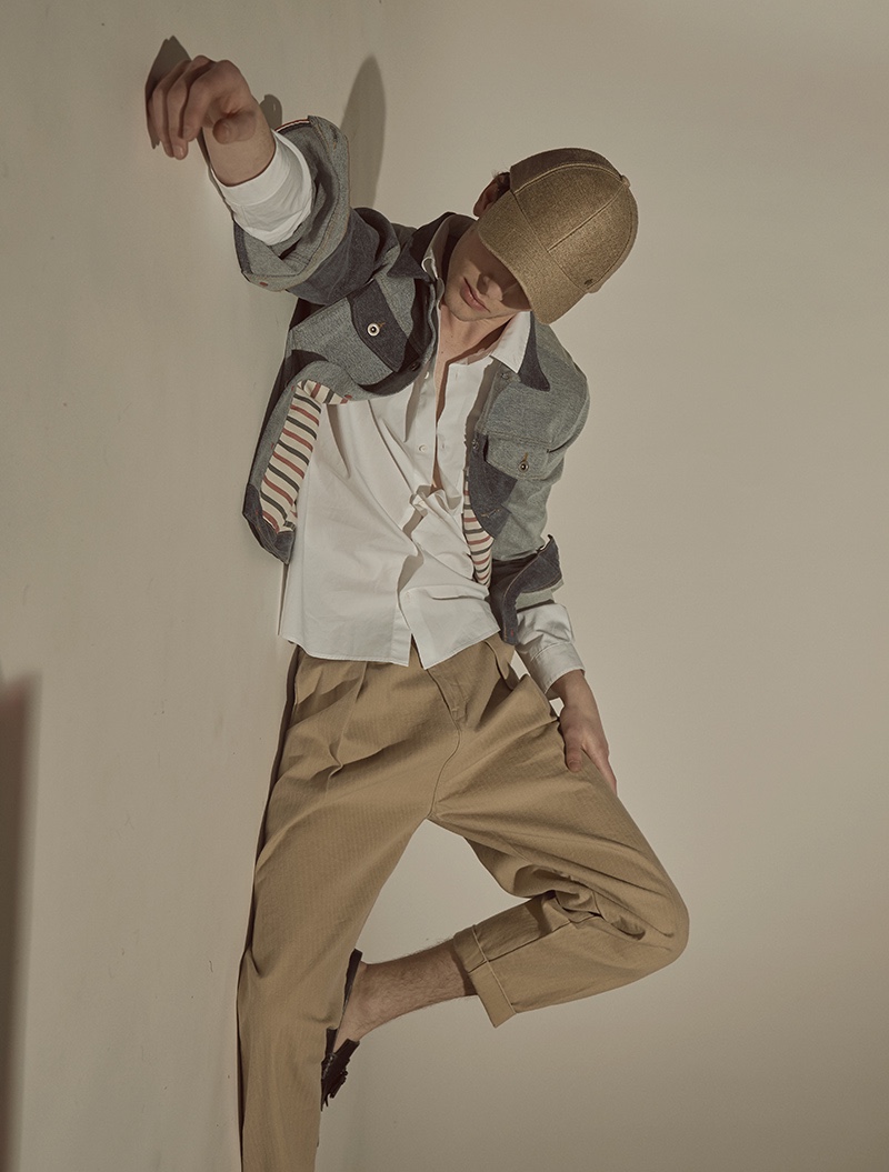 Thomas wears shirt COS, jacket Tommy Hilfiger, trousers Levi's Made & Crafted, cap Esprit, and shoes Tod's.