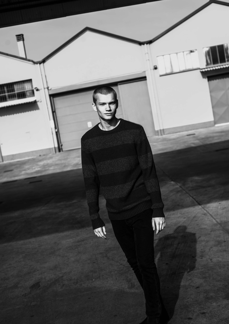 Jordy Gerritsma sports a Levi's striped sweater and black denim jeans.