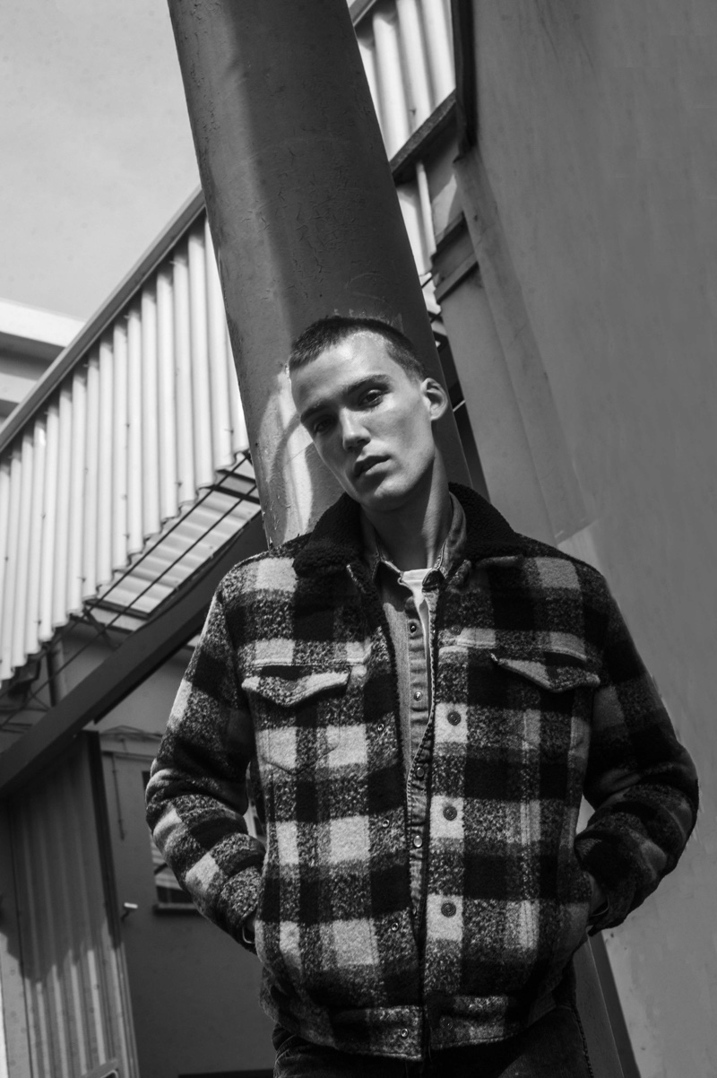 Ready for fall, Marc Lüloh wears a buffalo check jacket with a smart shirt and tee from Levi's.