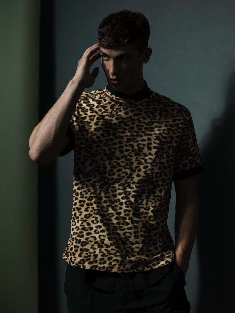 Jason wears leopard print shirt, polo, and pants by H&M.