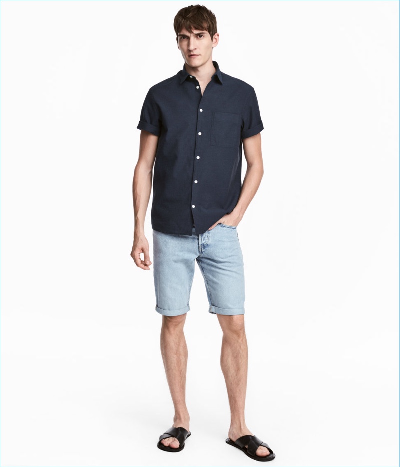 Front and center, Matvey Lykov wears light blue H&M denim shorts $19.99.