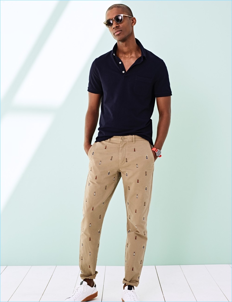 Piqué Polos: Claudio Monteiro models a J.Crew piqué polo shirt $45 with pants, sunglasses $99.99, and New Balance sneakers $75.