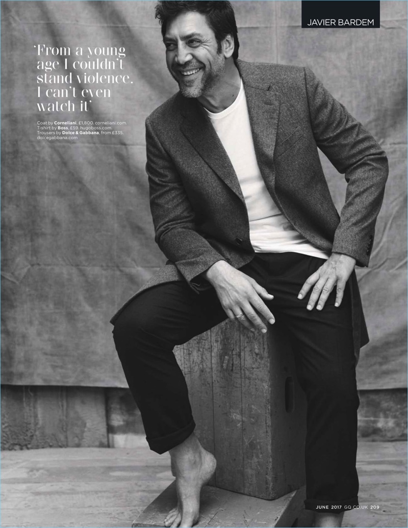 All smiles, Javier Bardem wears a Corneliani coat with a BOSS t-shirt and Dolce & Gabbana trousers.