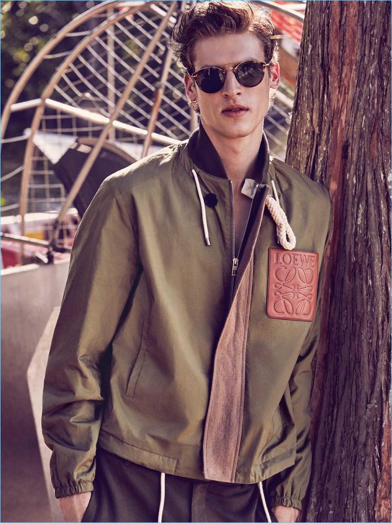 LOEWE jacket £1,100; BALENCIAGA trousers £295; OLIVER PEOPLES sunglasses £263