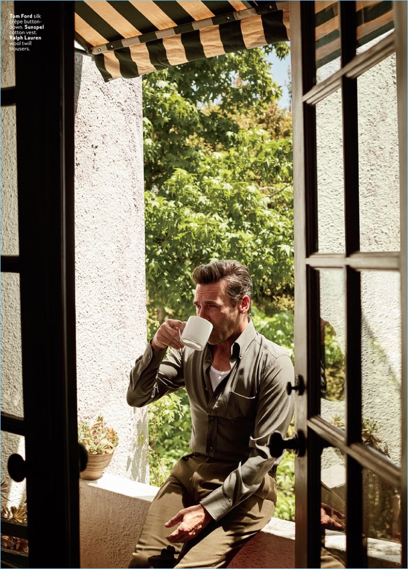Actor Jon Hamm sports a Tom Ford shirt with a Sunspel tank and Ralph Lauren trousers.