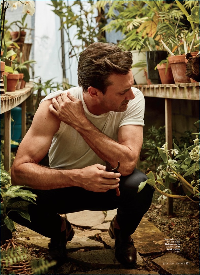 Tending to plants, Jon Hamm rocks a Sunspel t-shirt with Dolce & Gabbana trousers and John Lobb leather shoes.
