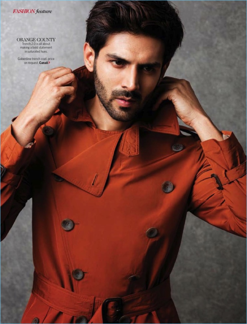 Making a case for orange, Kartik Aaryan wears a Canali trench coat.