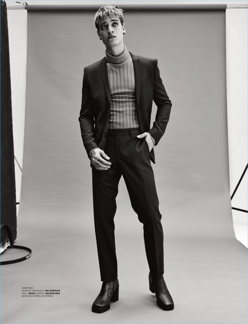 Jonathan Bellini dons a suit by The Kooples with a Gucci turtleneck sweater and Balenciaga boots.