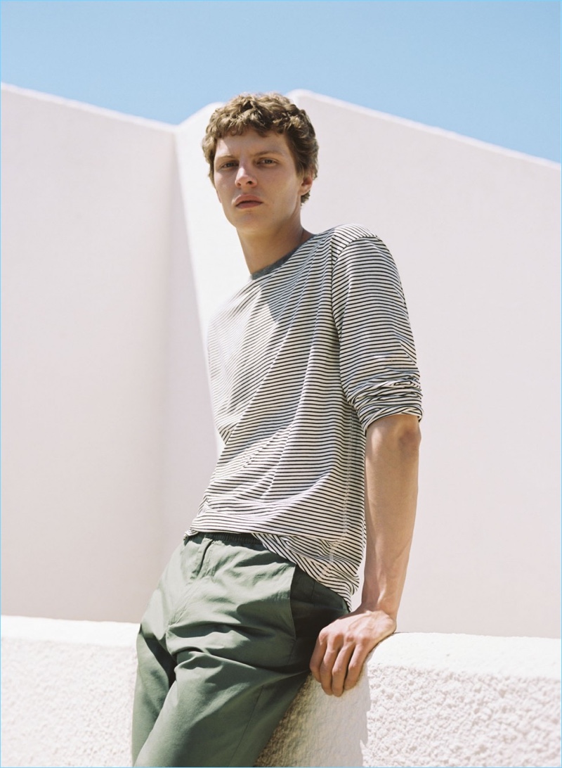 German model Tim Schuhmacher wears a Mango Man striped long-sleeve tee $29.99 with trousers $49.99.