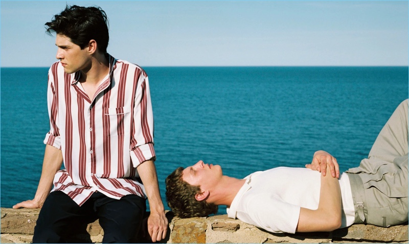 Left to Right: Luke Powell wears a striped shirt $69.99 and trousers $39.99. Tim Schuhmacher sports a white polo shirt $29.99 with pleated trousers $39.99.