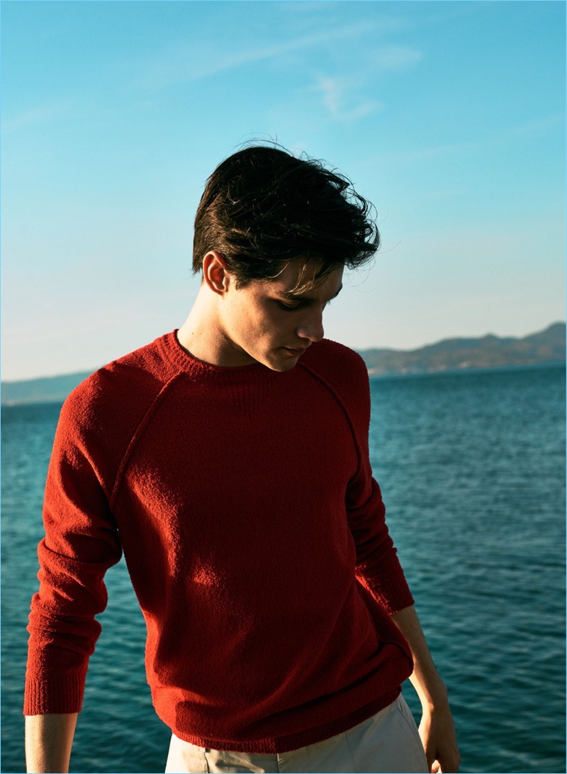 Luke Powell wears a red textured cotton sweater $39.99 and linen-cotton blend Bermuda shorts $49.99 from Mango Man.