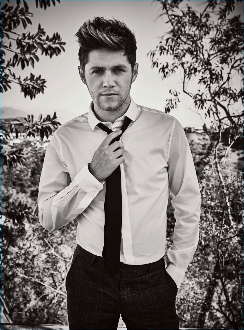 Singer Niall Horan dons a Paul Smith shirt with a tie and trousers.