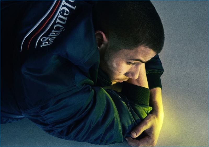 Singer Nick Jonas wears a Balenciaga bomber jacket for HERO magazine.