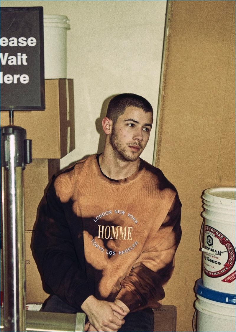 Keeping it casual, Nick Jonas wears a Balenciaga sweatshirt.