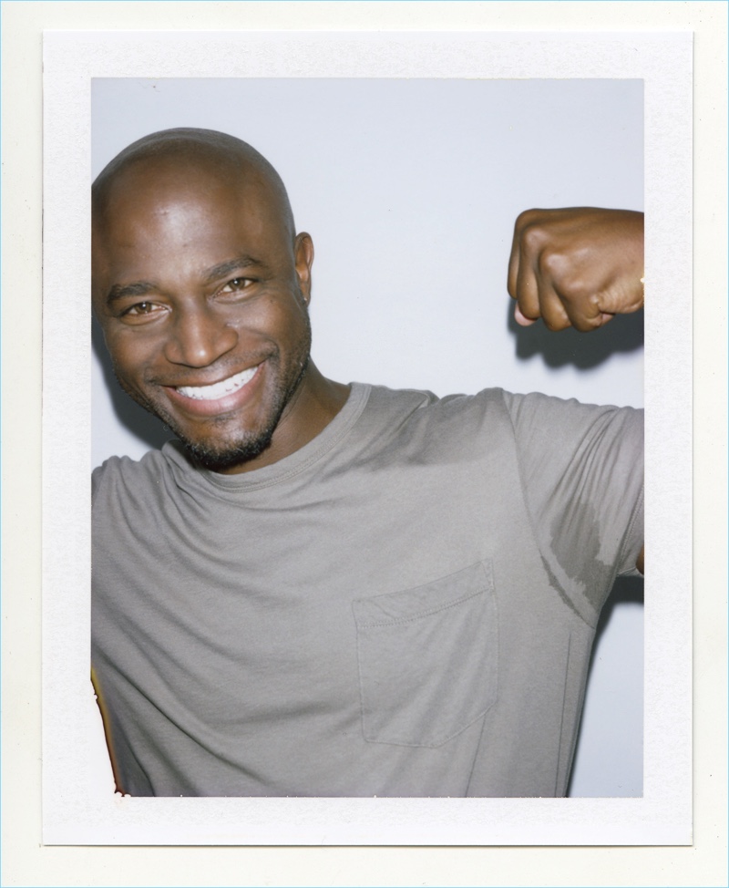 All smiles, Taye Diggs connects with Nordstrom for its Anniversary Sale and poses for a polaroid.