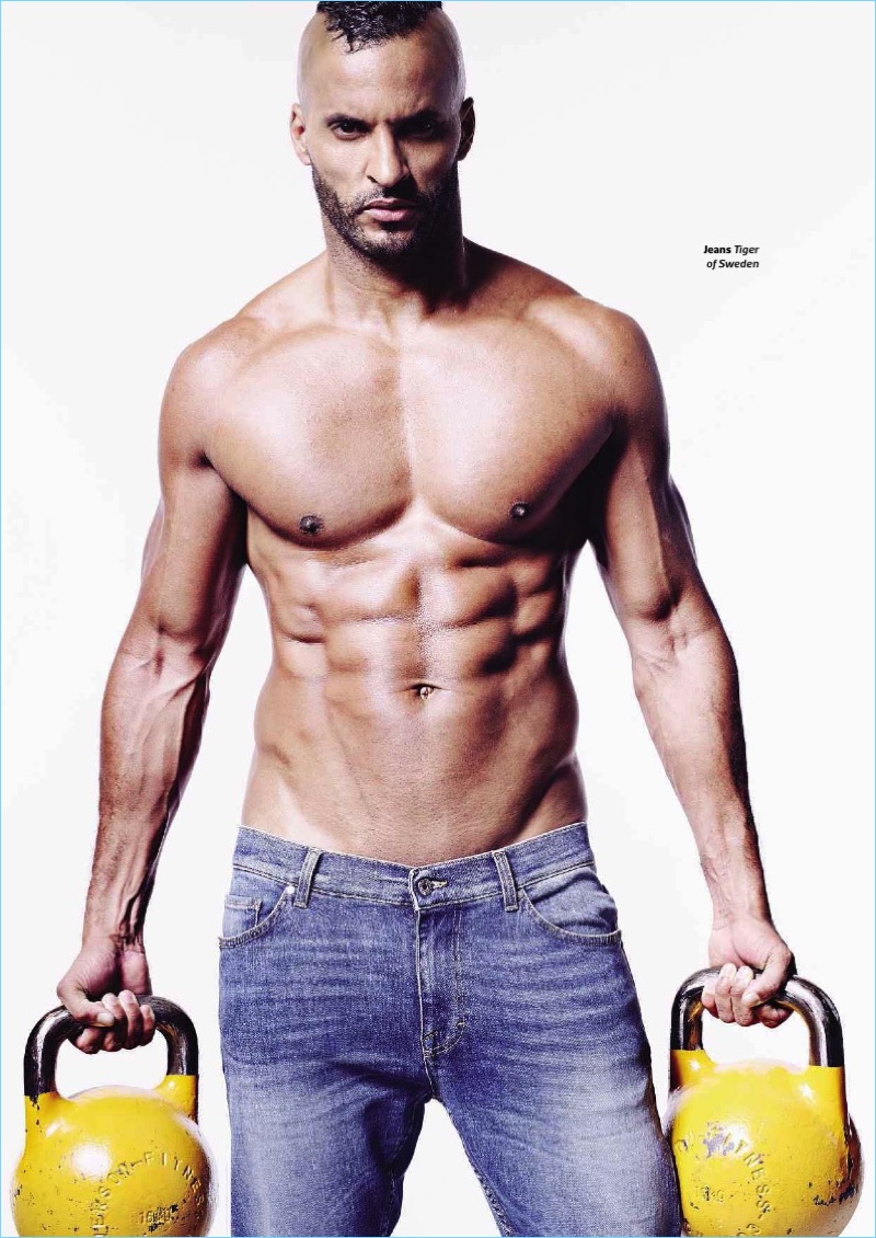 Appearing in a shirtless picture, Ricky Whittle wears Tiger of Sweden jeans.